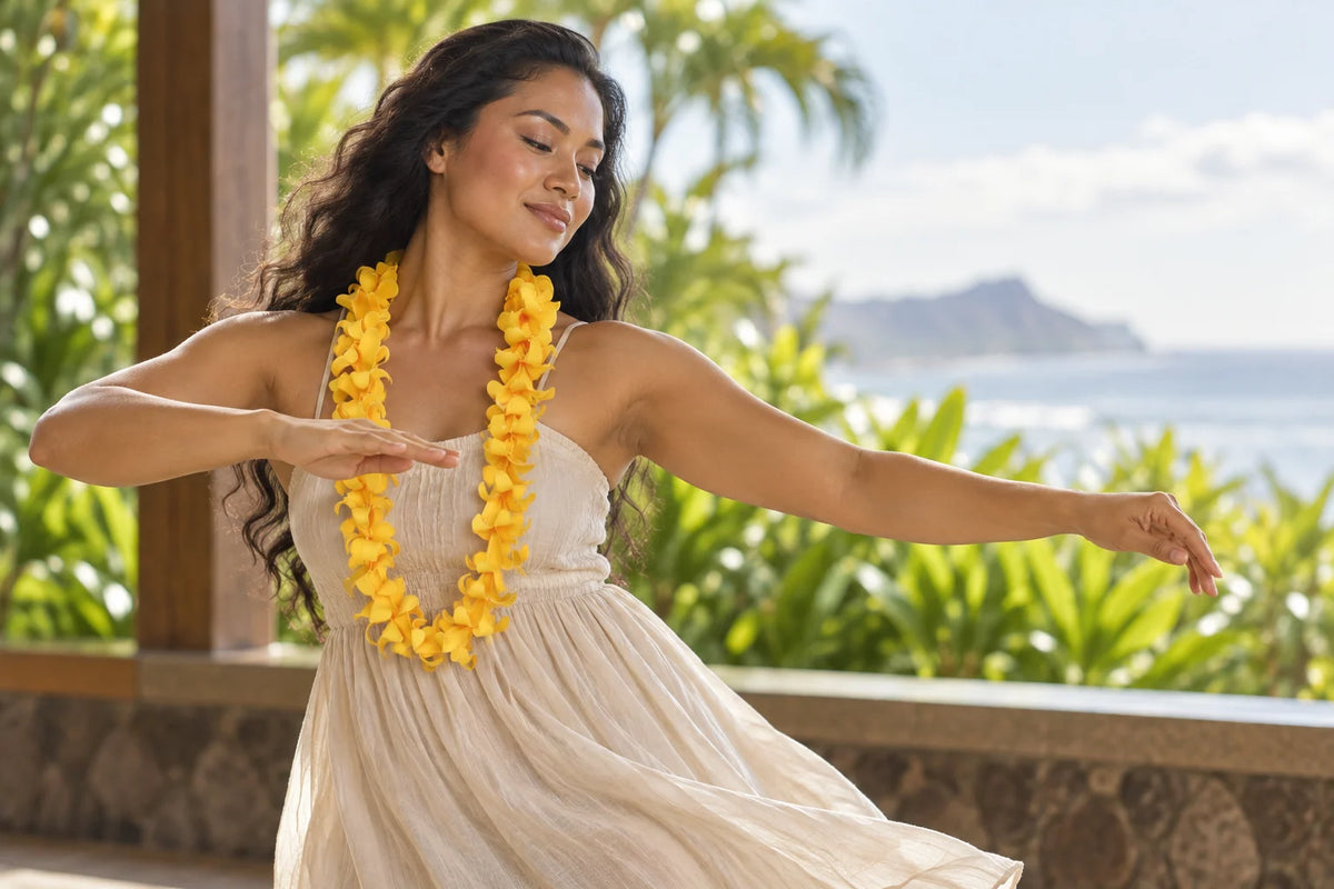 Hula performer wearing a yellow floral lei while moving on a tropical lanai